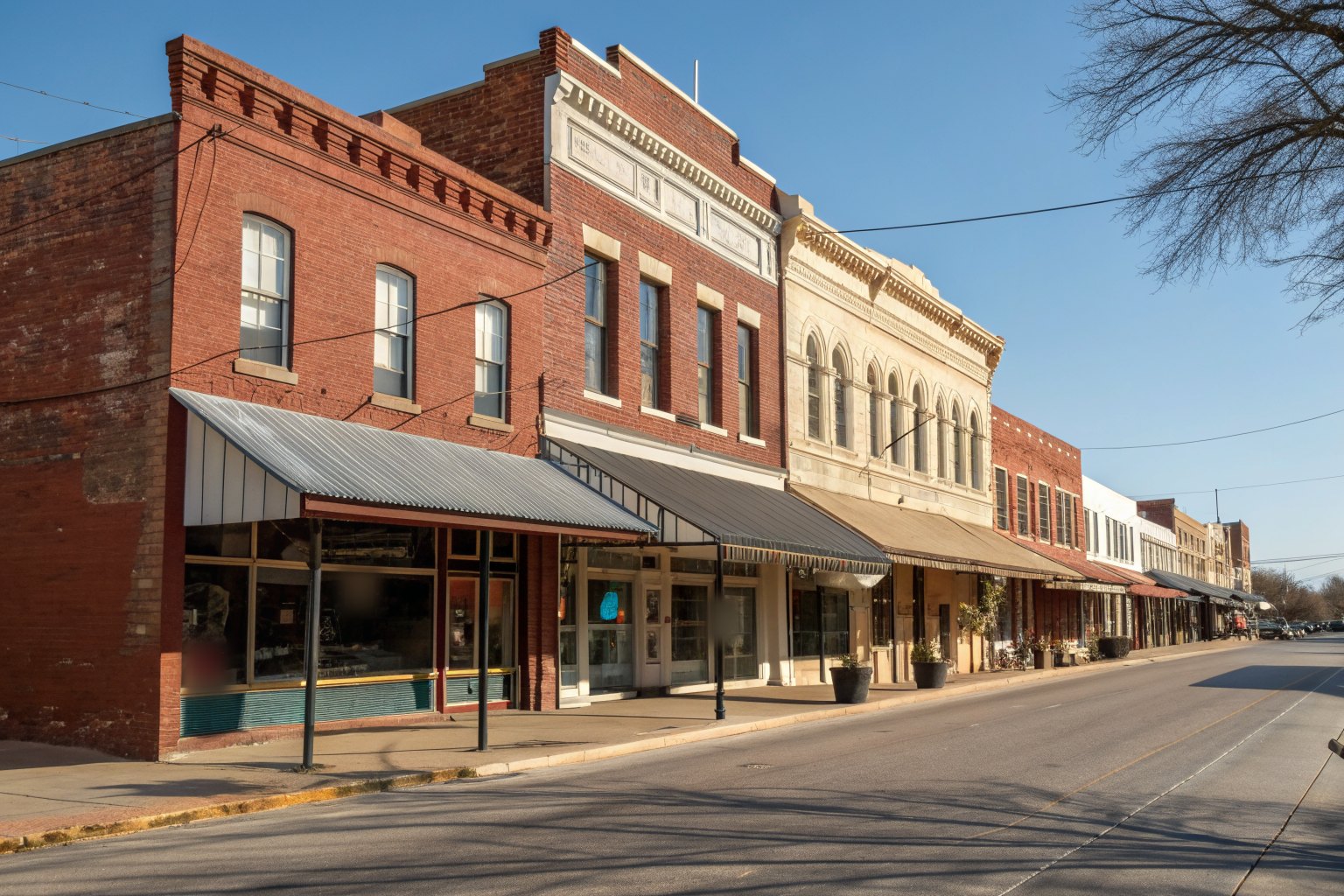 Old brick and stone storefronts around a small-town courthouse square